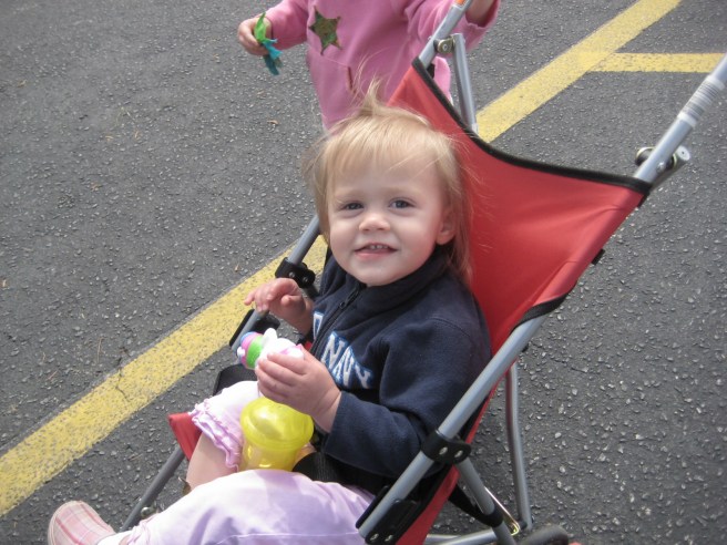 Mckayla, who happily rode in the stroller. She did get to share in the treats the girls won. 