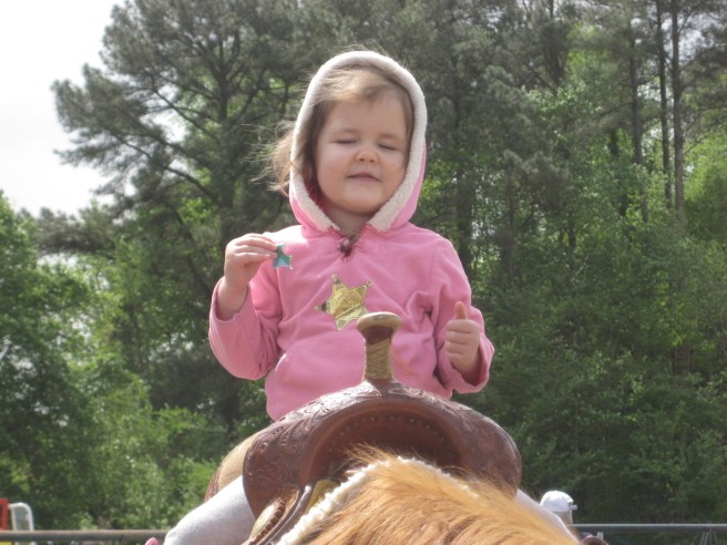 Happiness defined: Riding a horse while eating a fruit roll-up. She was complete.