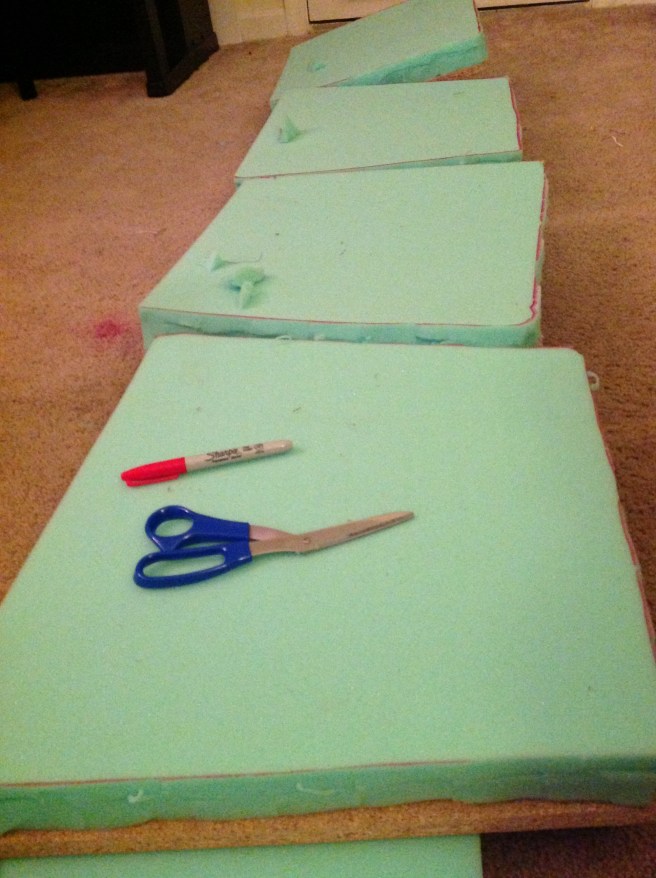 Tracing the shape of the particle board on the foam.