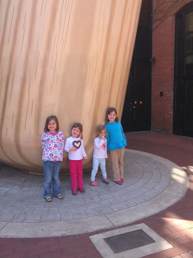 The girls loved the big bat outside.