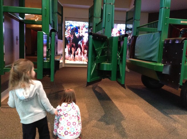 Gates and simulation at the entrance of the Kentucky Derby museum.