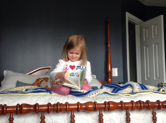 Reading on mom's bed. Hale Navy color in my bedroom - I love it!